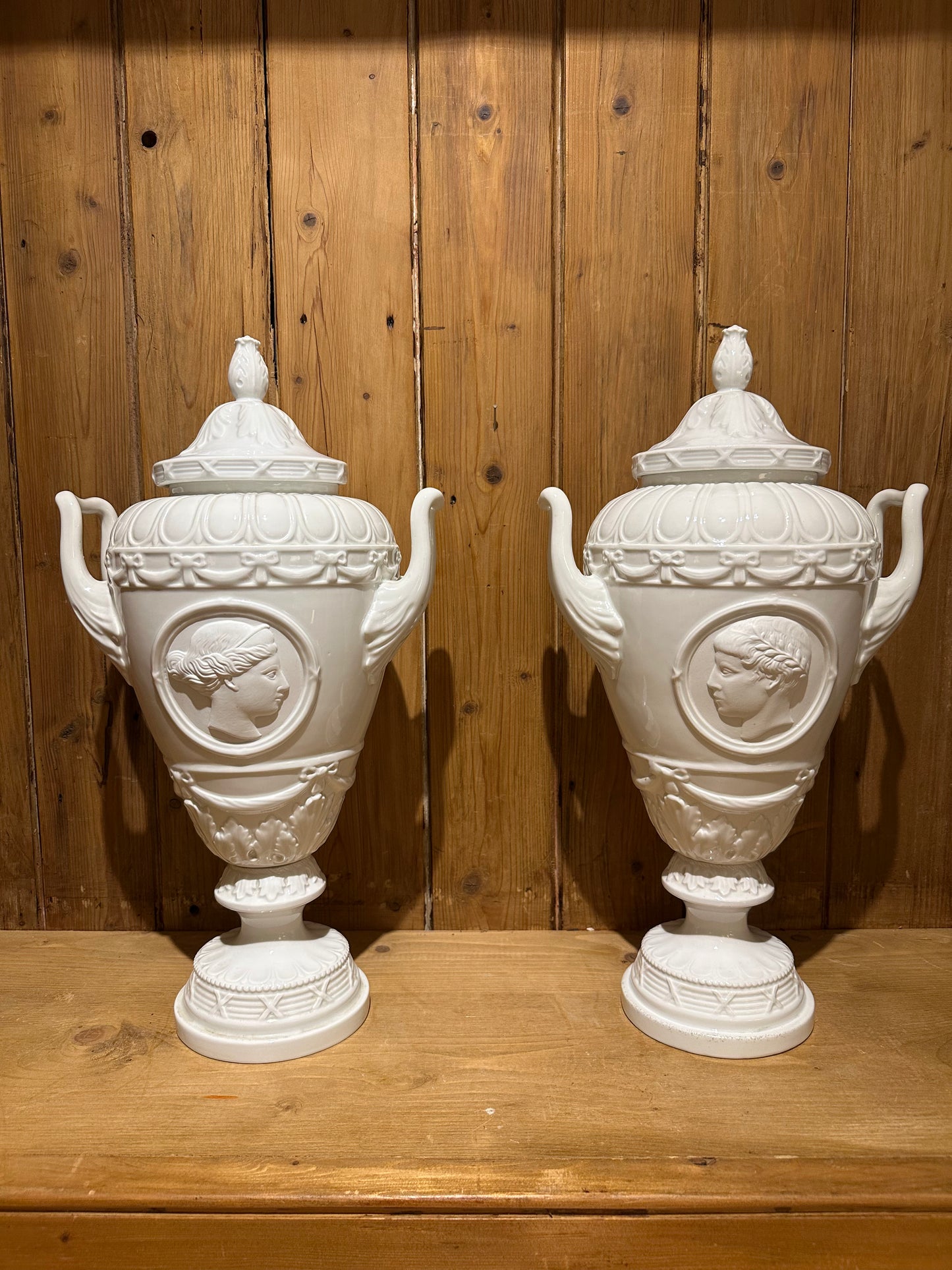 Pair of White Glazed Italian Neo Classical Covered Urns