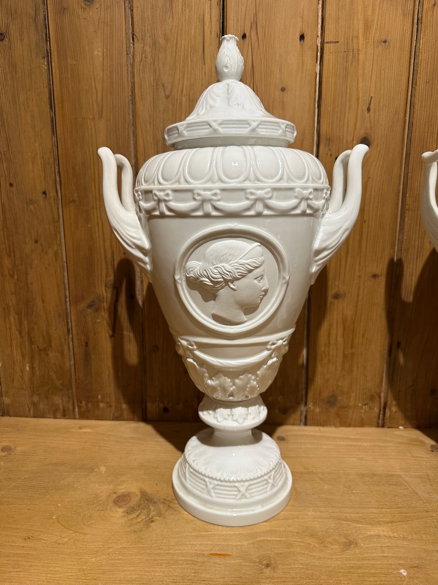 Pair of White Glazed Italian Neo Classical Covered Urns