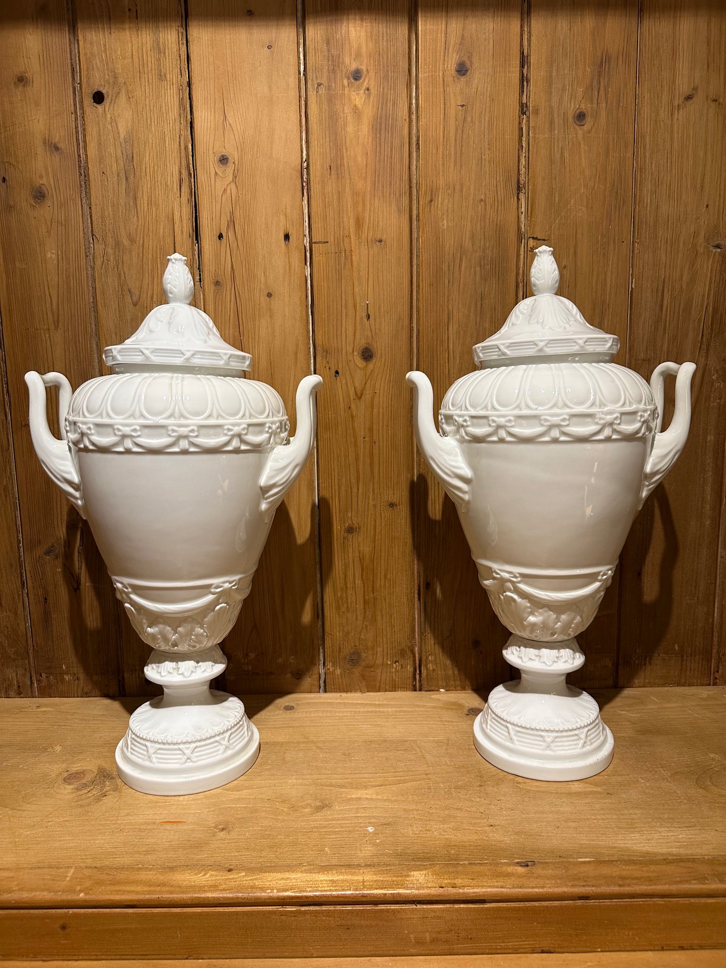 Pair of White Glazed Italian Neo Classical Covered Urns