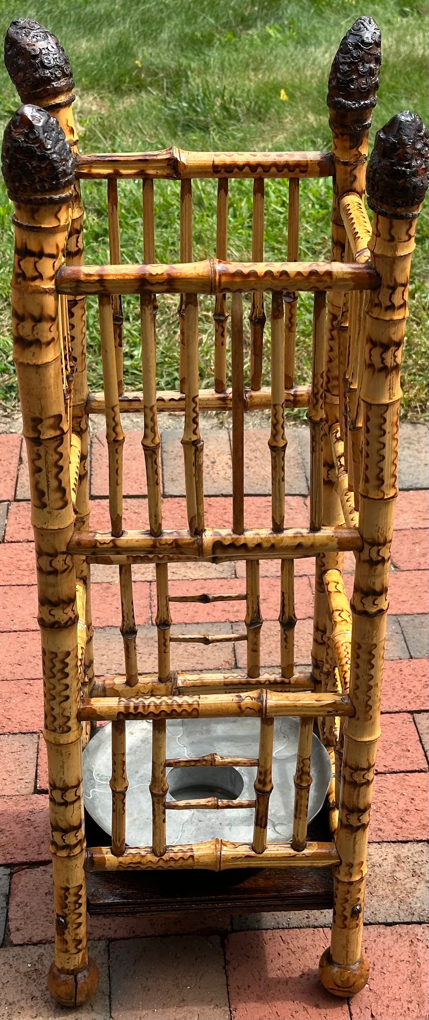 Late 19th Century Bamboo Umbrella stand with insert. Burned decoration on bamboo. Circa 1885.